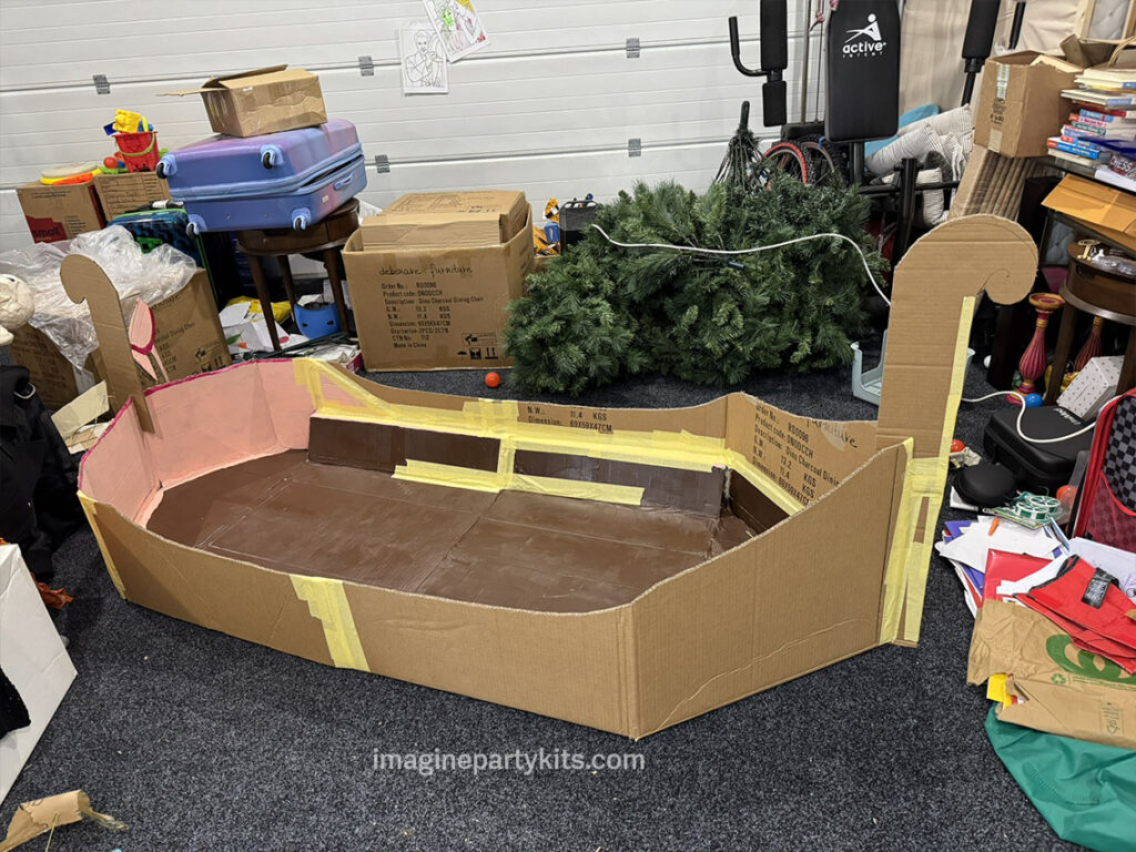 Constructing Rapunzel's boat from Tangled as a birthday party prop