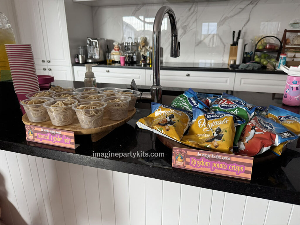 Serving Rapunzel's golden hair spaghetti for tangled party food